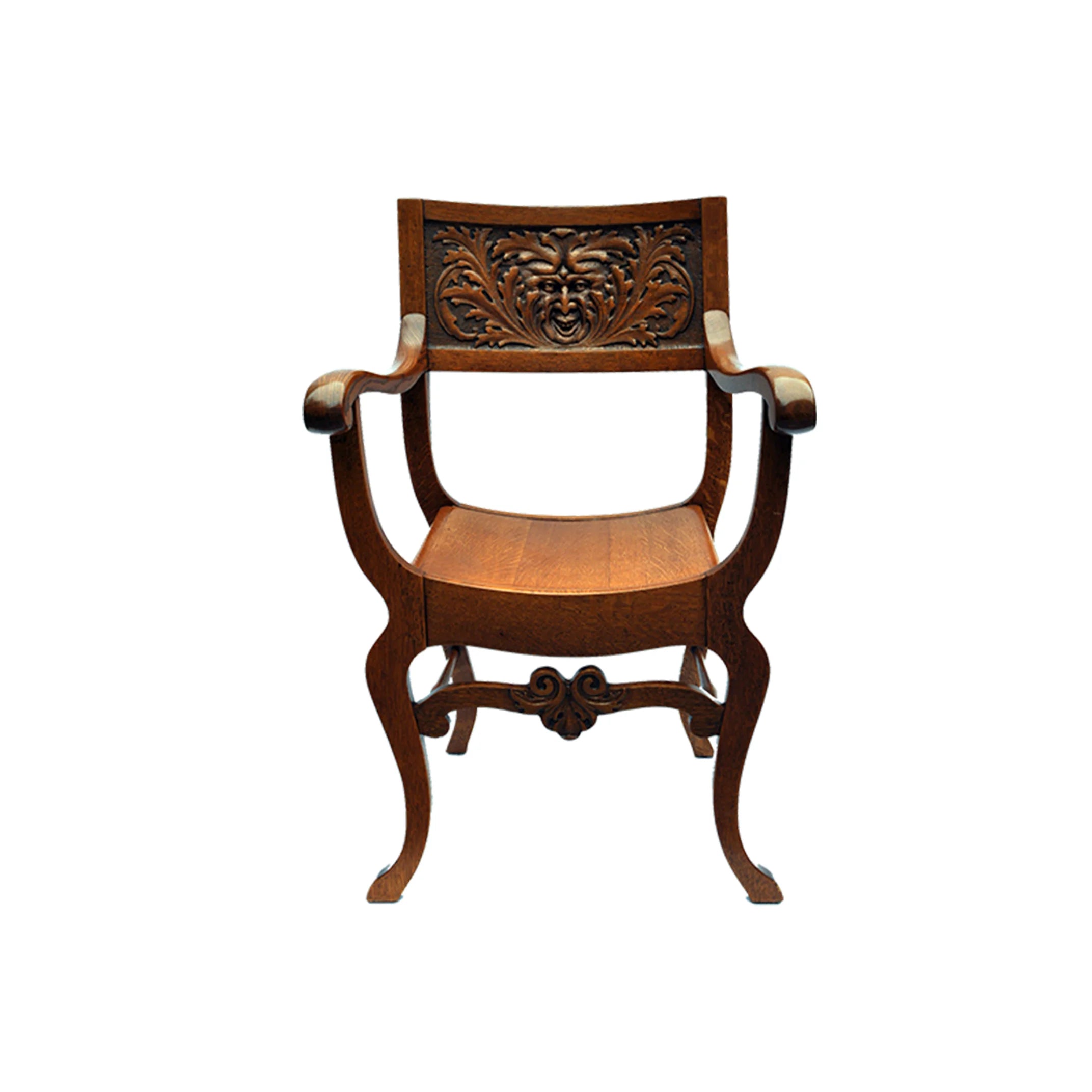 A HIGHLY CARVED AMERICAN OAK CURULE CHAIR W/VISAGE
