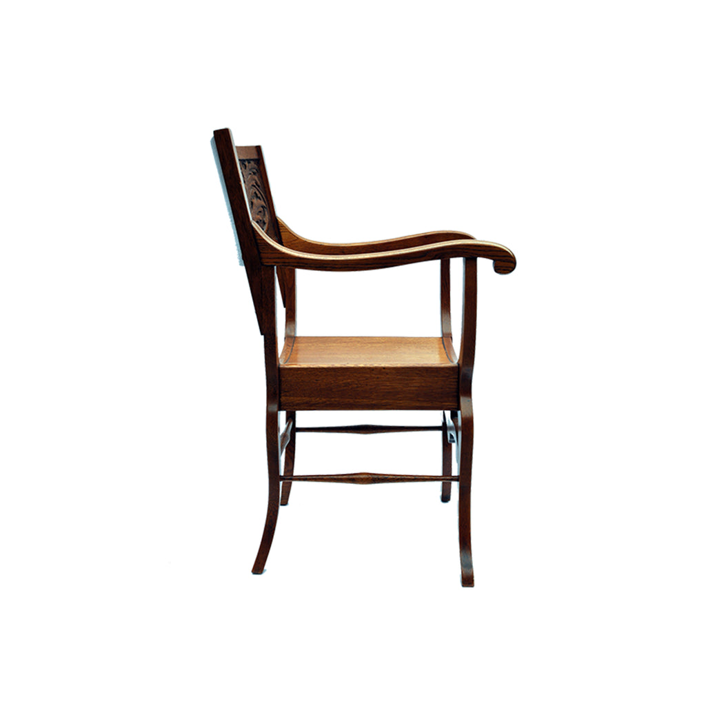 A HIGHLY CARVED AMERICAN OAK CURULE CHAIR W/VISAGE
